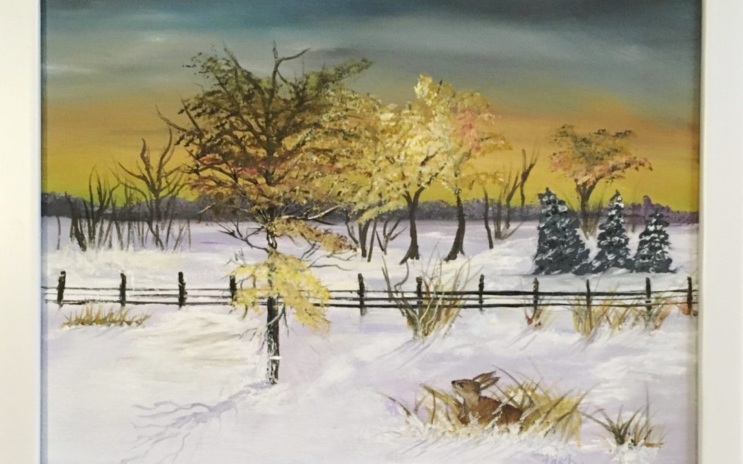 snowy landscape with an old fence. There are trees on either side of fence and a bunny peeking out of tall grass in the foreground