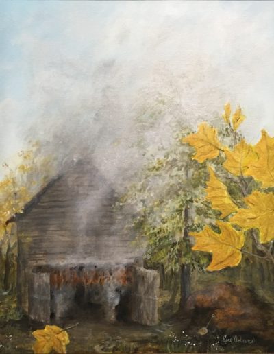 image of a barn full of hanging tobacco with smoke pouring out all openings. Next to the barn is a tree with golden leaves leaving no doubt the time of year is autumn.